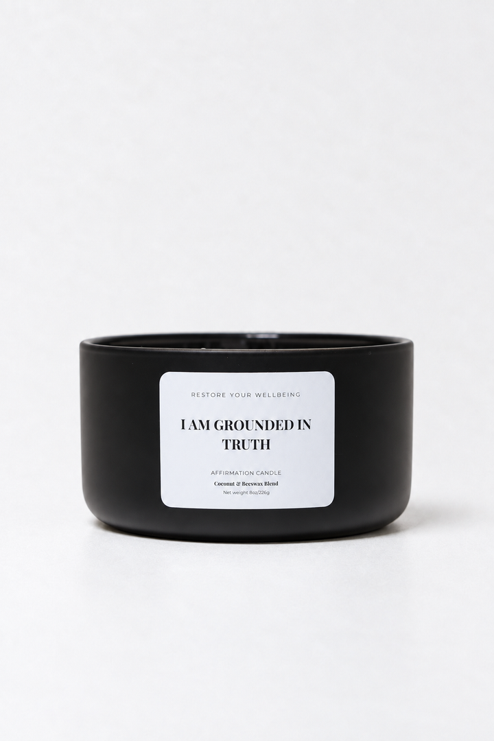Black Calista glass affirmation candle labeled I Am Grounded in Truth