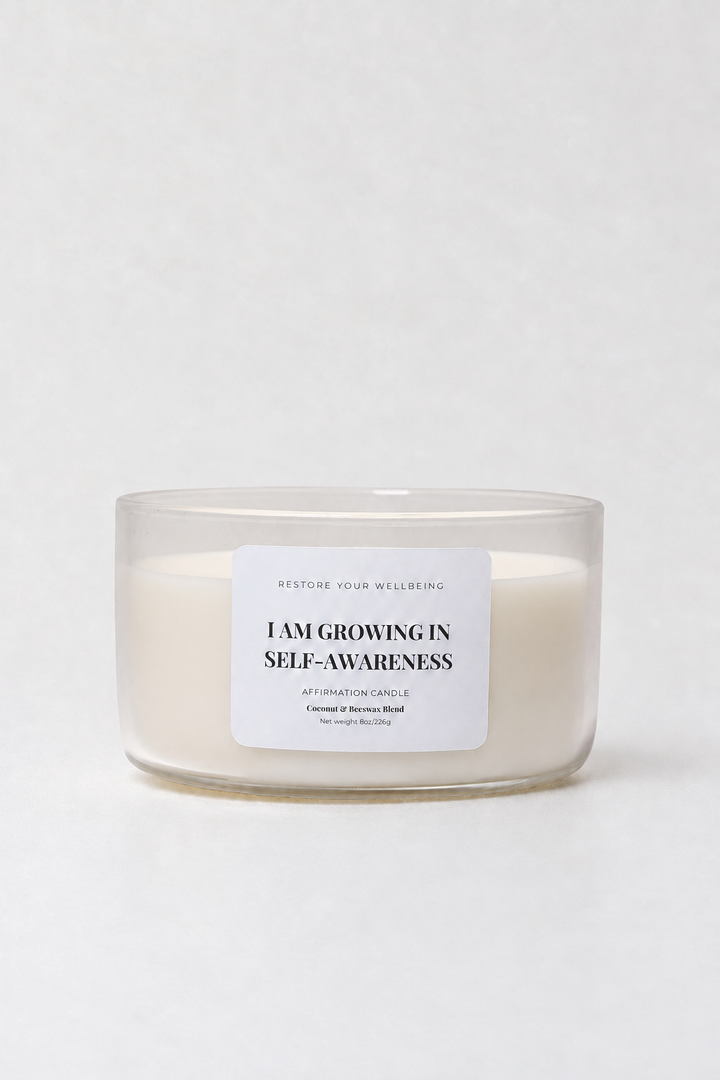 Clear Calista glass affirmation candle labeled I Am Growing in Self-Awareness